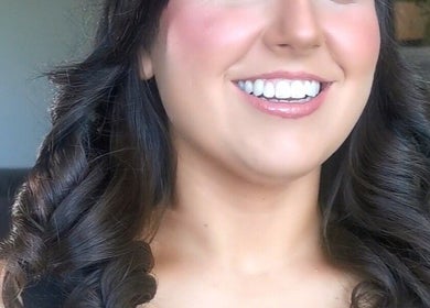 Woman with styled brunette curls smiling at Galway, County Galway, County Galway, IE salon.