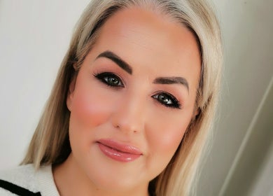 Close-up of a woman's radiant face representing beauty services at Galway, County Galway, IE.