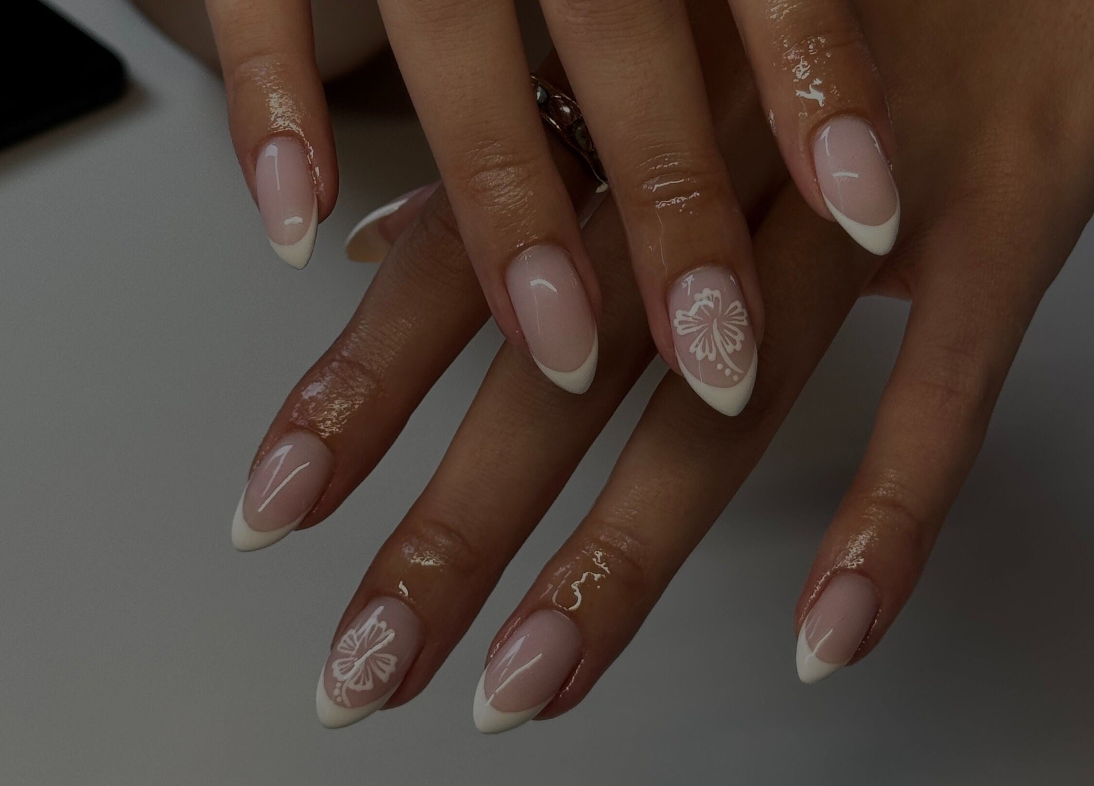 French manicure with floral design at Gel Serenity, Advancetown, Queensland, AU.