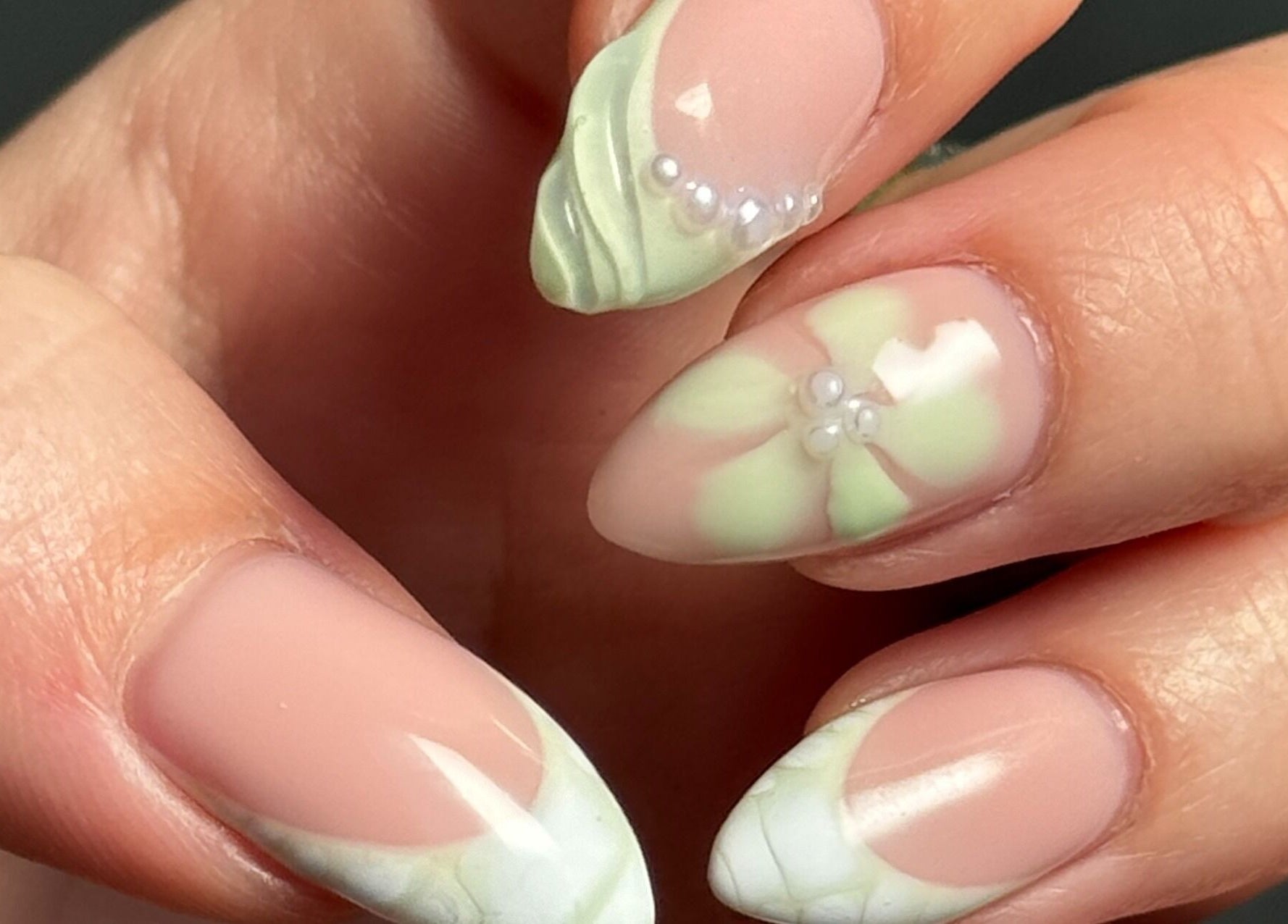 Delicate floral nail art with pearls at Gel Serenity in Advancetown, Queensland, AU.