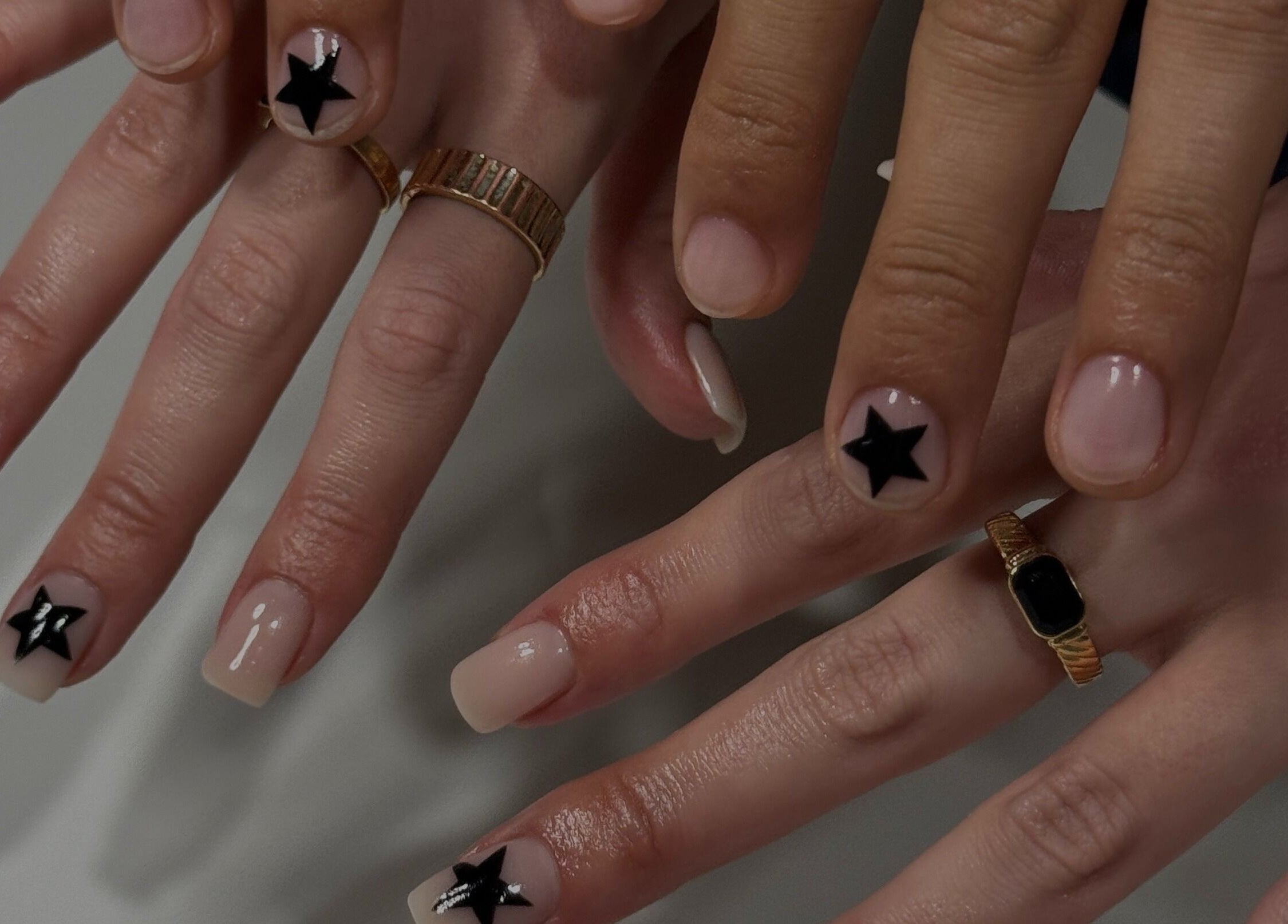 Gel Serenity nail art with black stars in Advancetown, Queensland, AU showcasing artistic manicure.