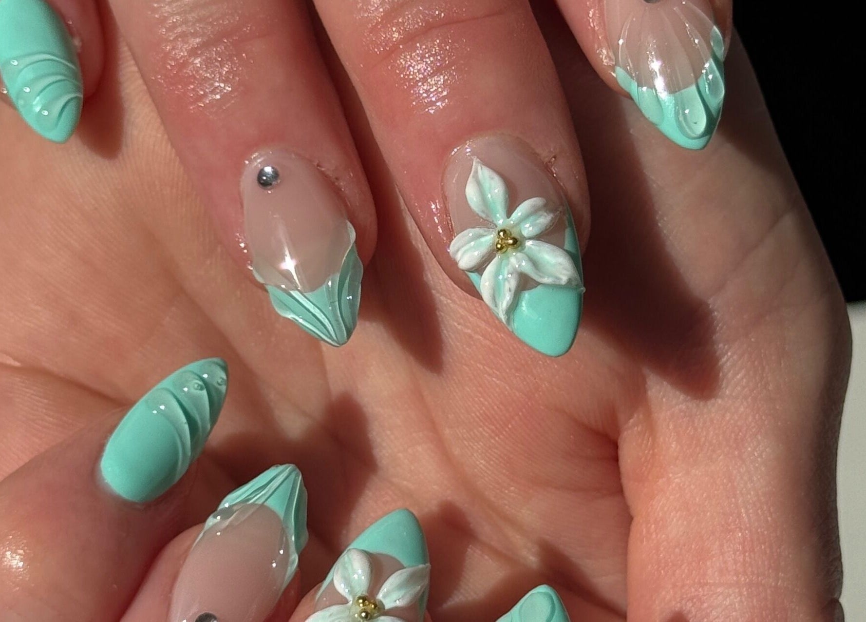 Elegant floral nail art with mint accents at Gel Serenity, Advancetown, Queensland, AU.