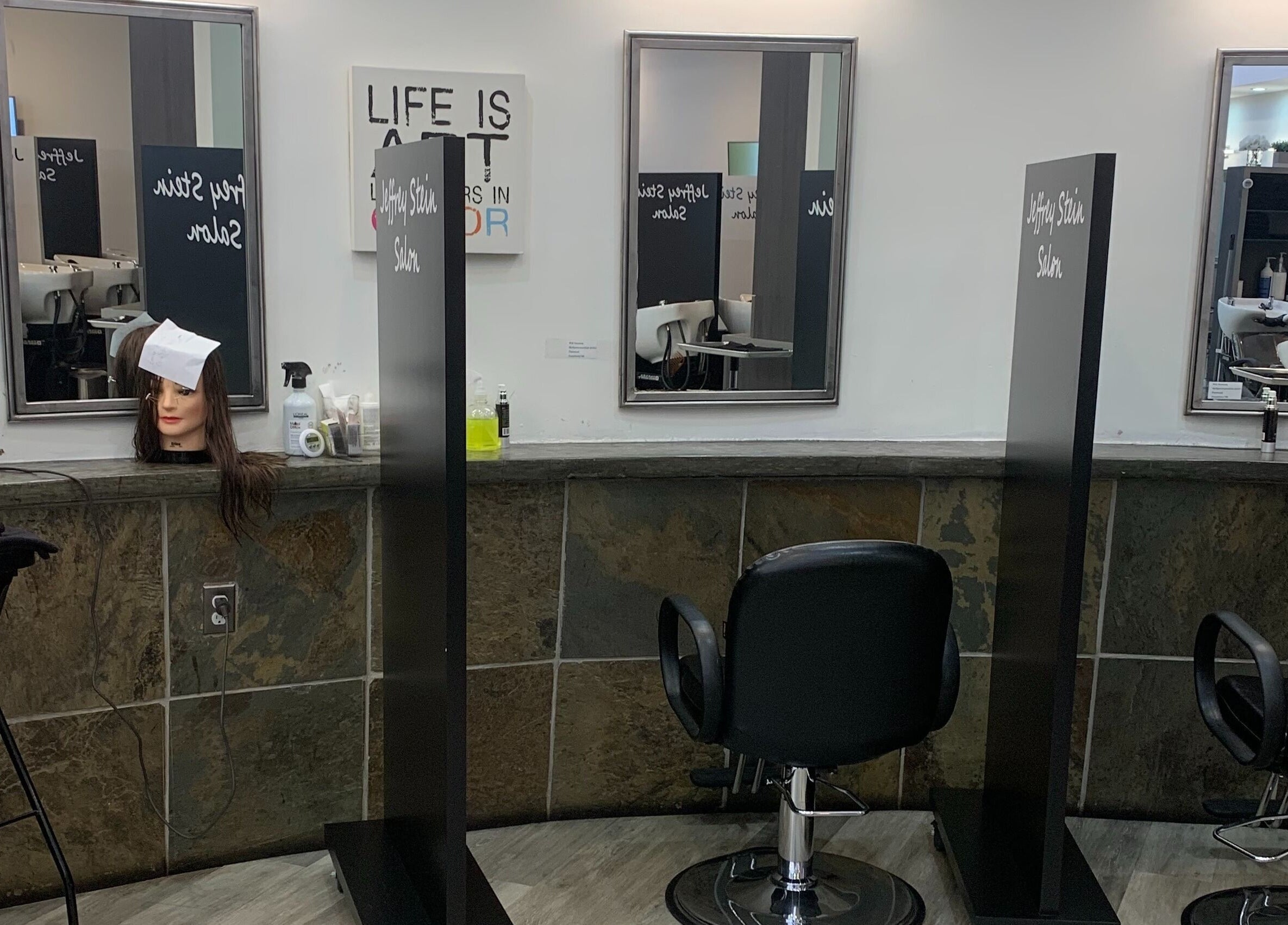 Inside Jeffrey Stein Salon, New York, New York, US, featuring modern styling chairs and sleek mirrors.