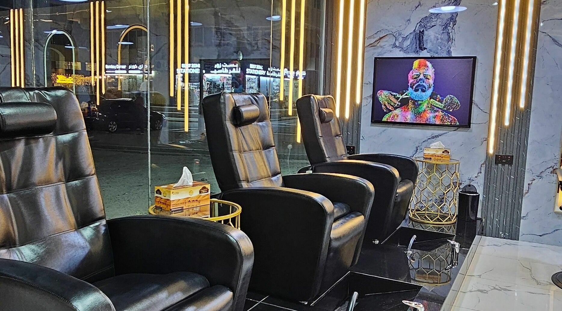 Luxurious seating area at San Giorgio Gents Salon, أبو ظبي, أبو ظبي, AE, with modern decor and stylish chairs.