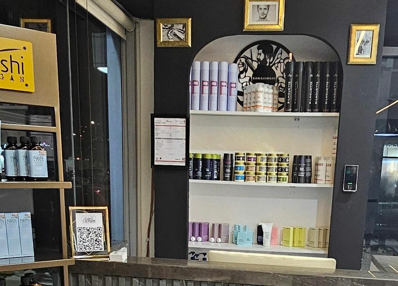 San Giorgio Gents Salon in أبو ظبي, AE showcases premium hair care products on elegant shelves.