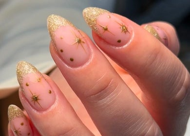 Elegant gold glitter nail art at Beauty by Harriet - Glow Hair Salon, Crownhill, England, GB.