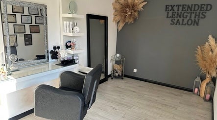 Elegant interior of Extended Lengths Salon, Grays, England, GB featuring stylish furniture and decor.