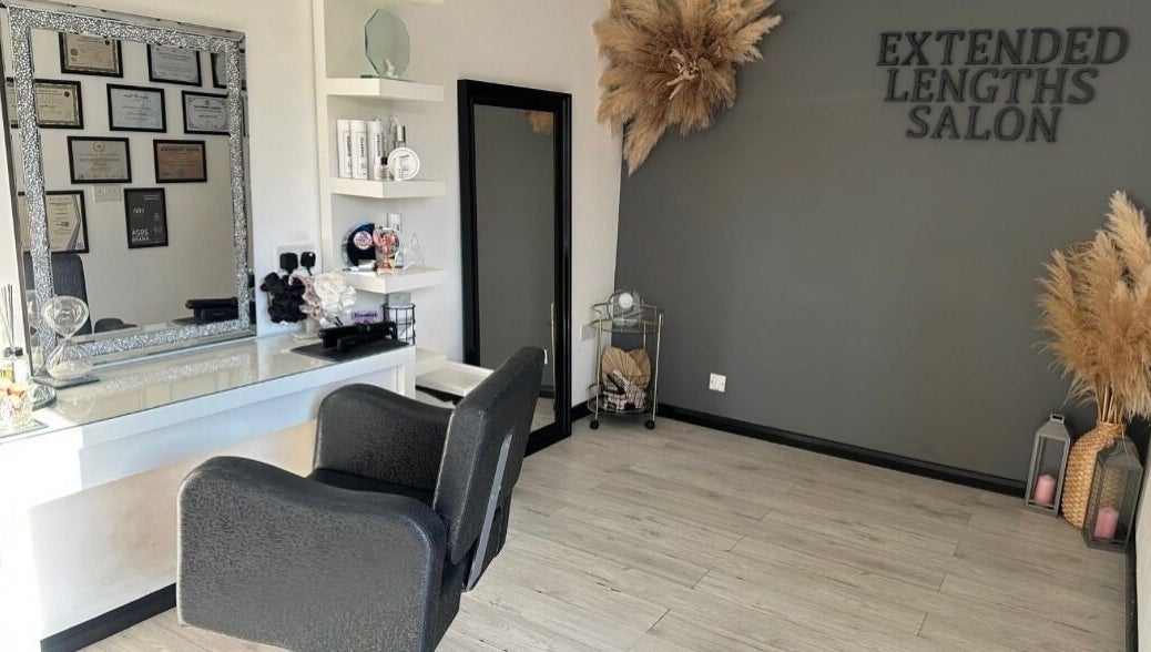 Modern chic interior of Extended Lengths Salon, Grays, England, GB, featuring elegant decor and stylish mirrors.