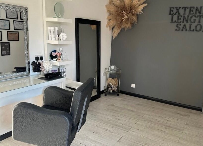 Modern chic interior of Extended Lengths Salon, Grays, England, GB, featuring elegant decor and stylish mirrors.