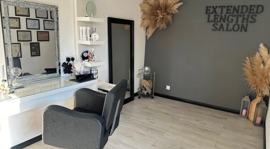 Modern chic interior of Extended Lengths Salon, Grays, England, GB, featuring elegant decor and stylish mirrors.