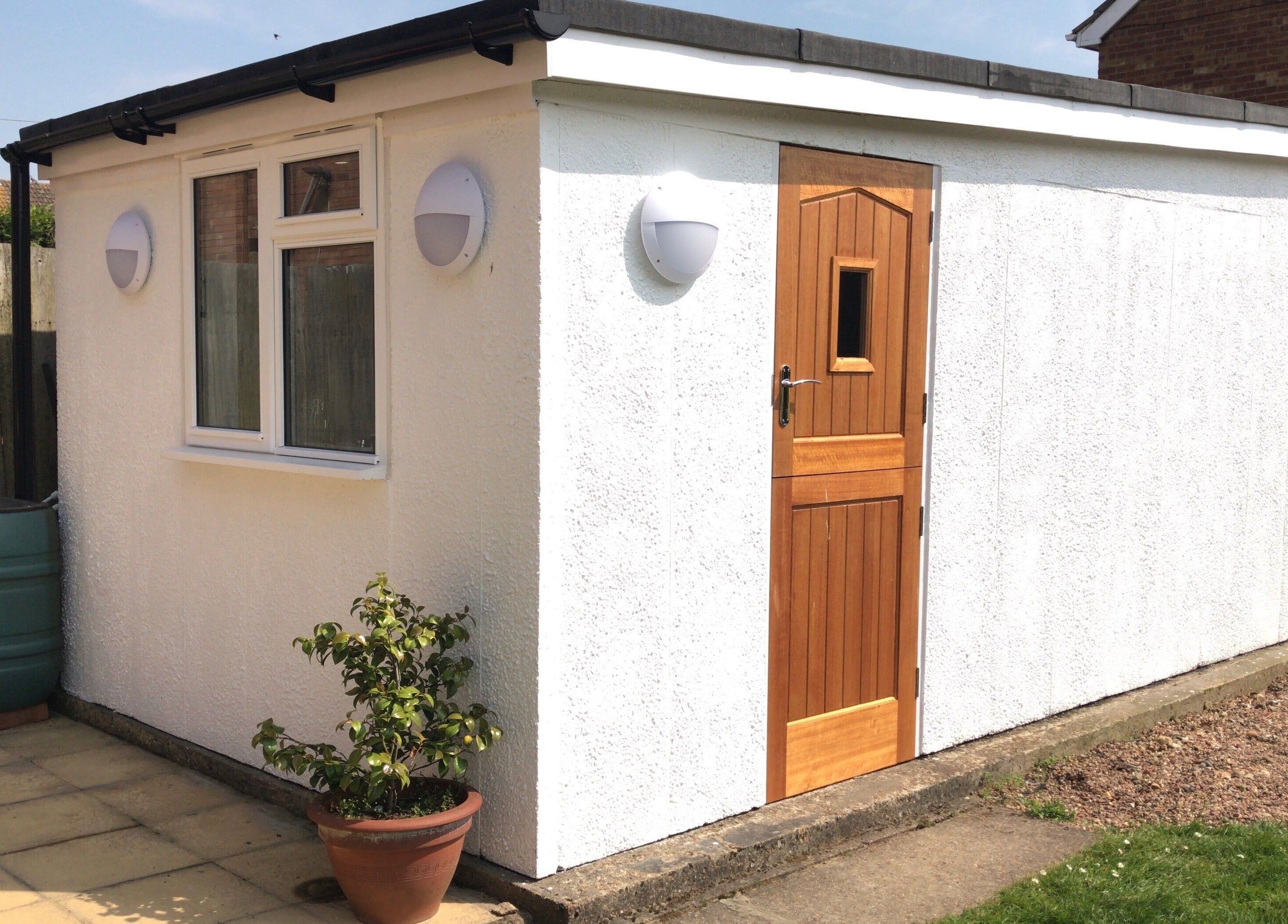 Entrance of Extended Lengths Salon, Grays, England, GB, showcasing a quaint exterior with a wooden door.