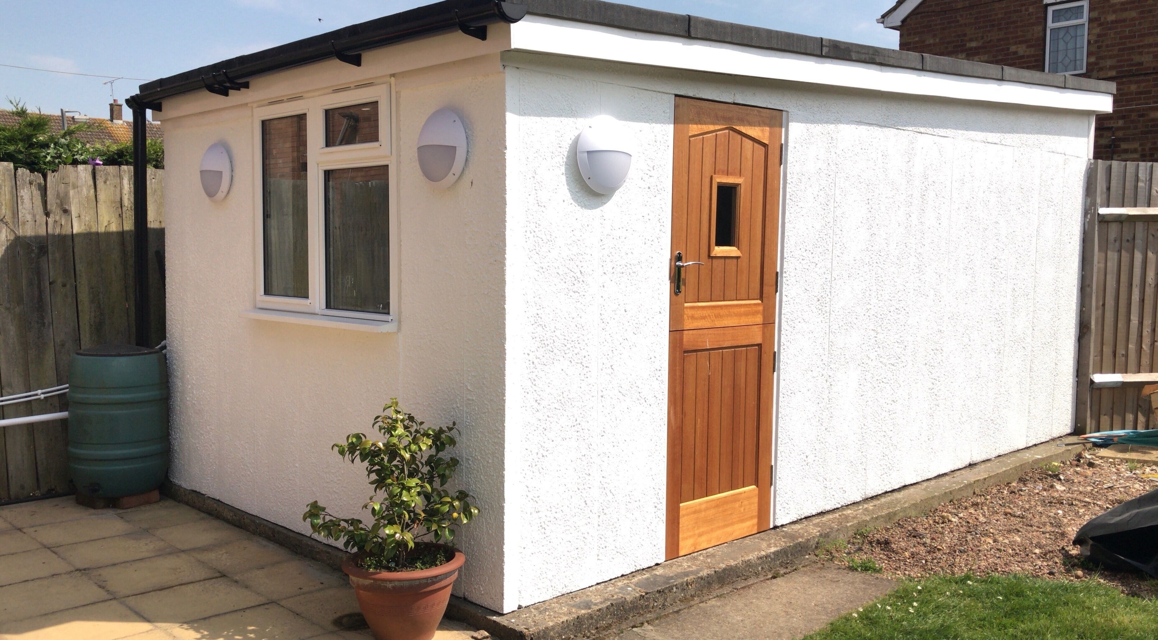 Entrance of Extended Lengths Salon, Grays, England, GB, showcasing a quaint exterior with a wooden door.