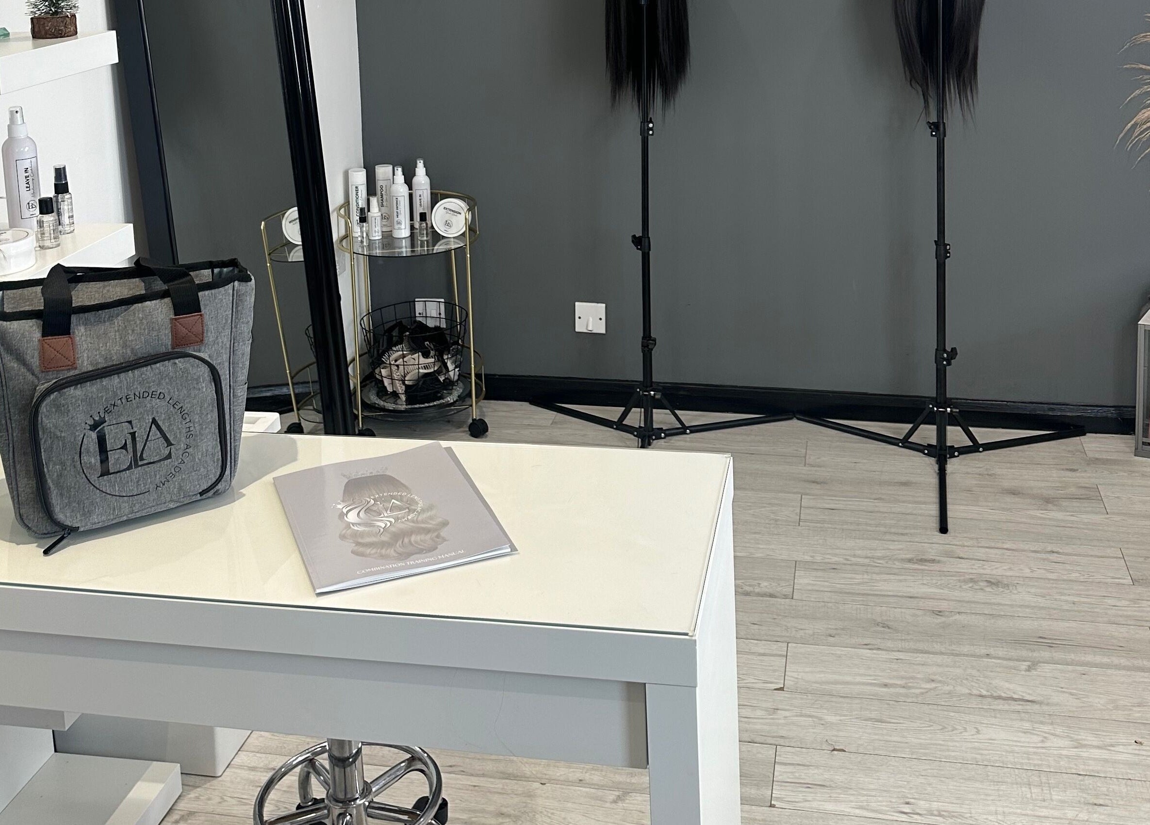 Modern interior of Extended Lengths Salon in Grays, England, GB, featuring stylish decor and hairdressing tools.