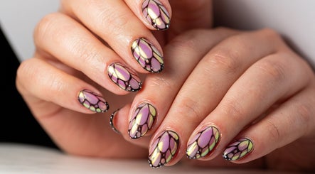 Intricate butterfly nail art at Dia Nailed It, Hove, England, GB showcases elegant design and vibrant colors.
