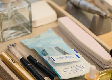 Professional nail tools set at Dia Nailed It, Hove, England, GB showcasing cuticle serums and files.