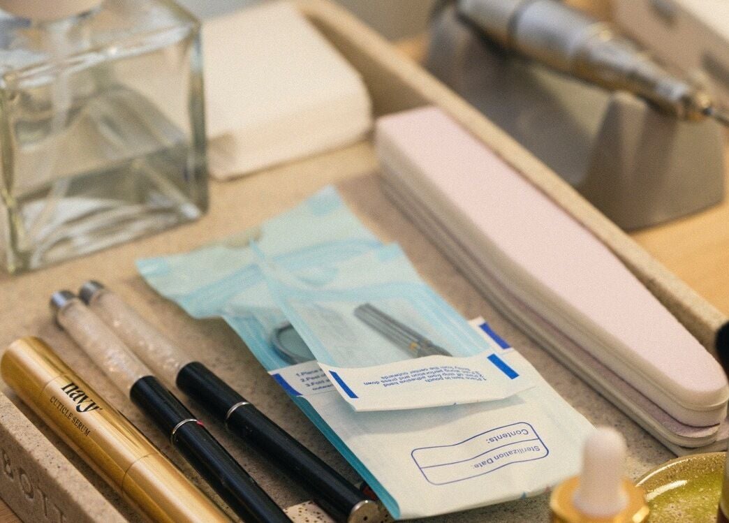 Professional nail tools set at Dia Nailed It, Hove, England, GB showcasing cuticle serums and files.