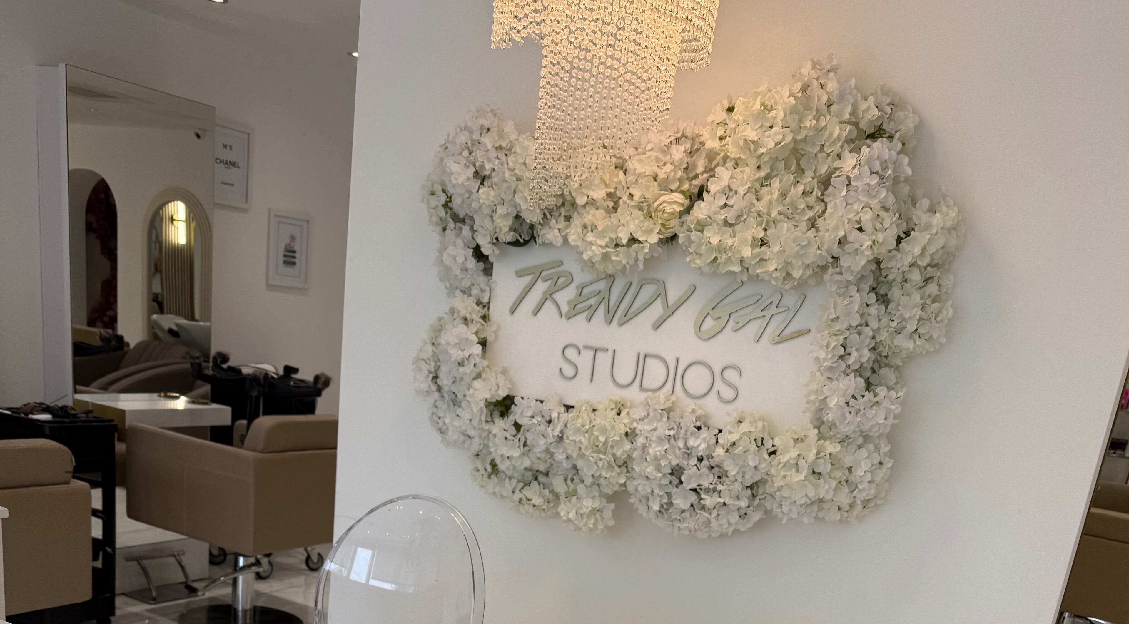 Elegant salon entrance at Jess Wilson Hair in Upton, Wirral, England, GB adorned with floral decor.