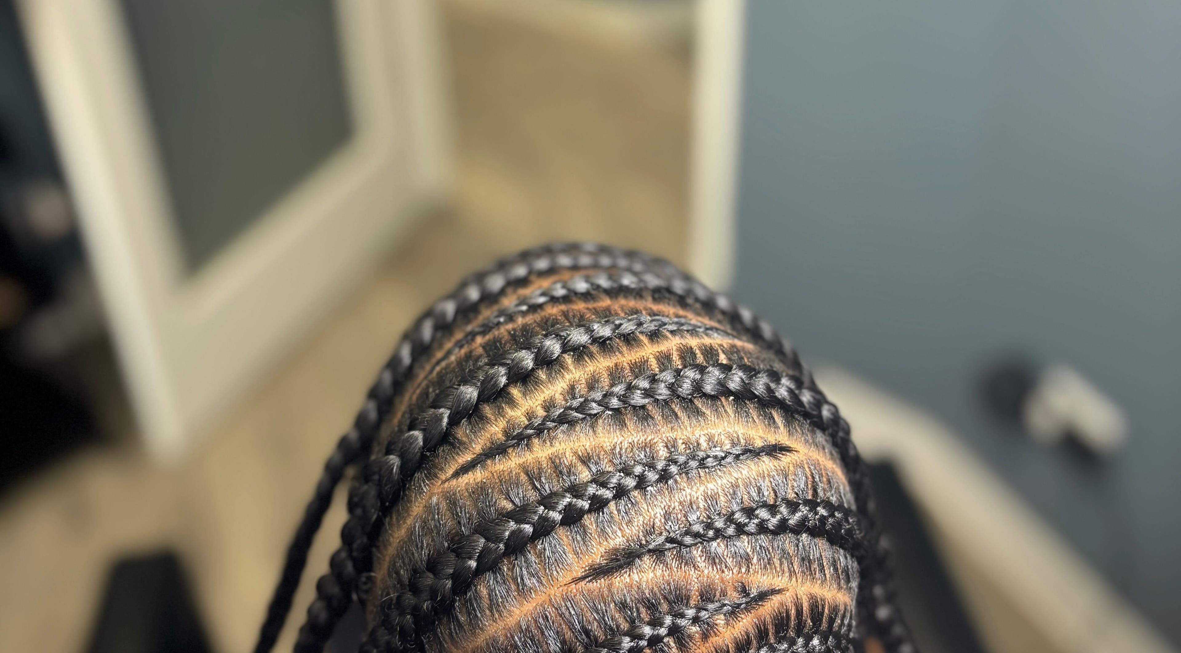 Intricate braided hairstyle at Michelle Todriana, Hammond, Illinois. Exceptional styling service displayed.