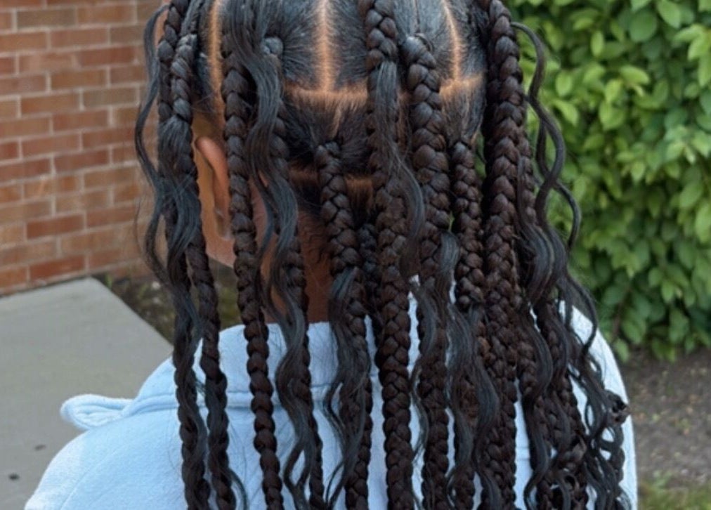 Intricate braided hairstyle at Michelle Todriana in Hammond, Illinois, US, highlighting expert styling.