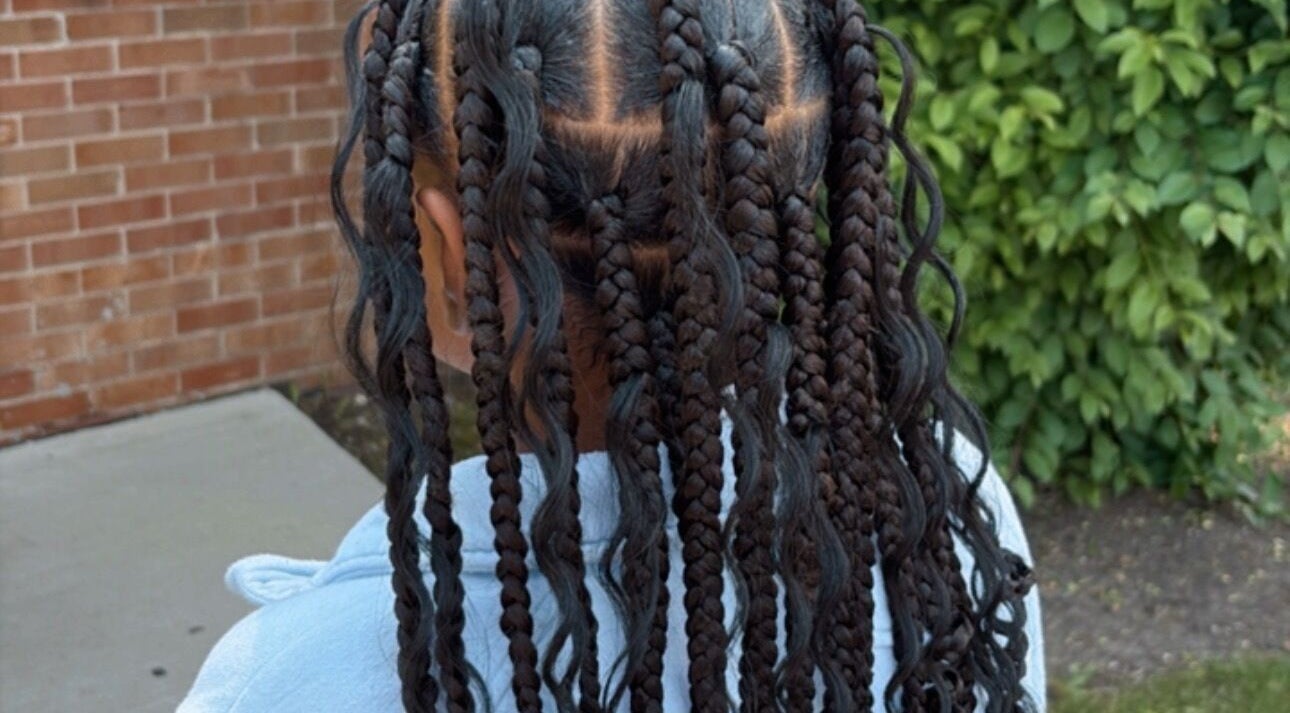 Intricate braided hairstyle at Michelle Todriana in Hammond, Illinois, US, highlighting expert styling.