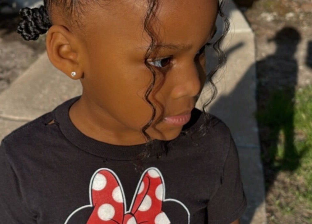 Young girl with styled hair at Michelle Todriana, Hammond, Illinois, US. A natural and adorable expression.