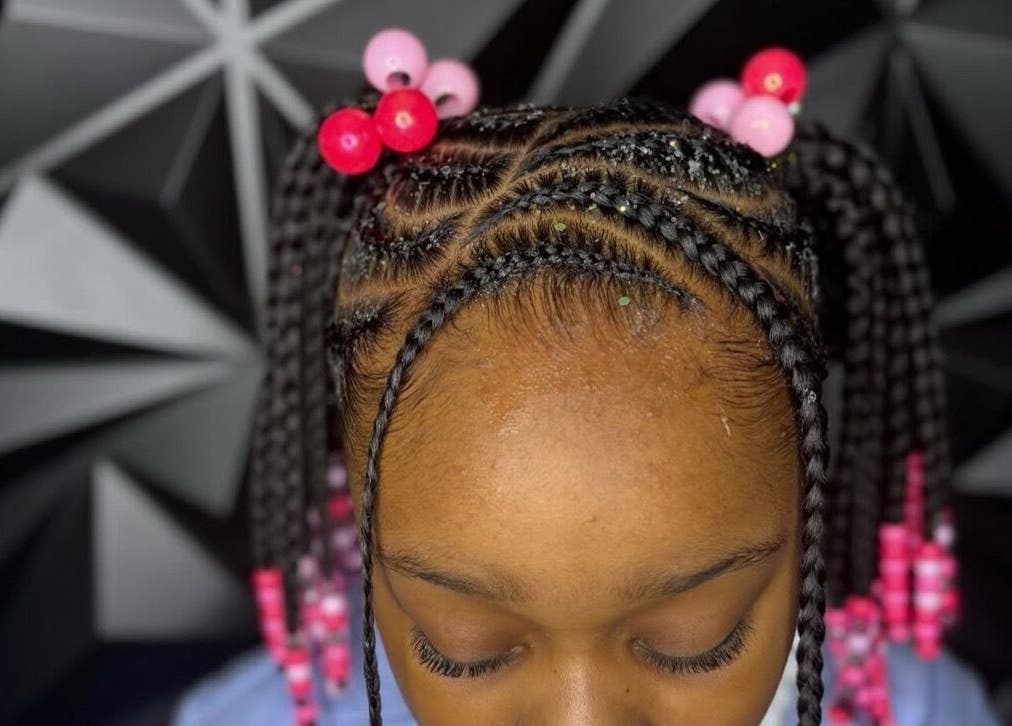 Intricate braids with pink beads at Michelle Todriana, Hammond, Illinois, US.