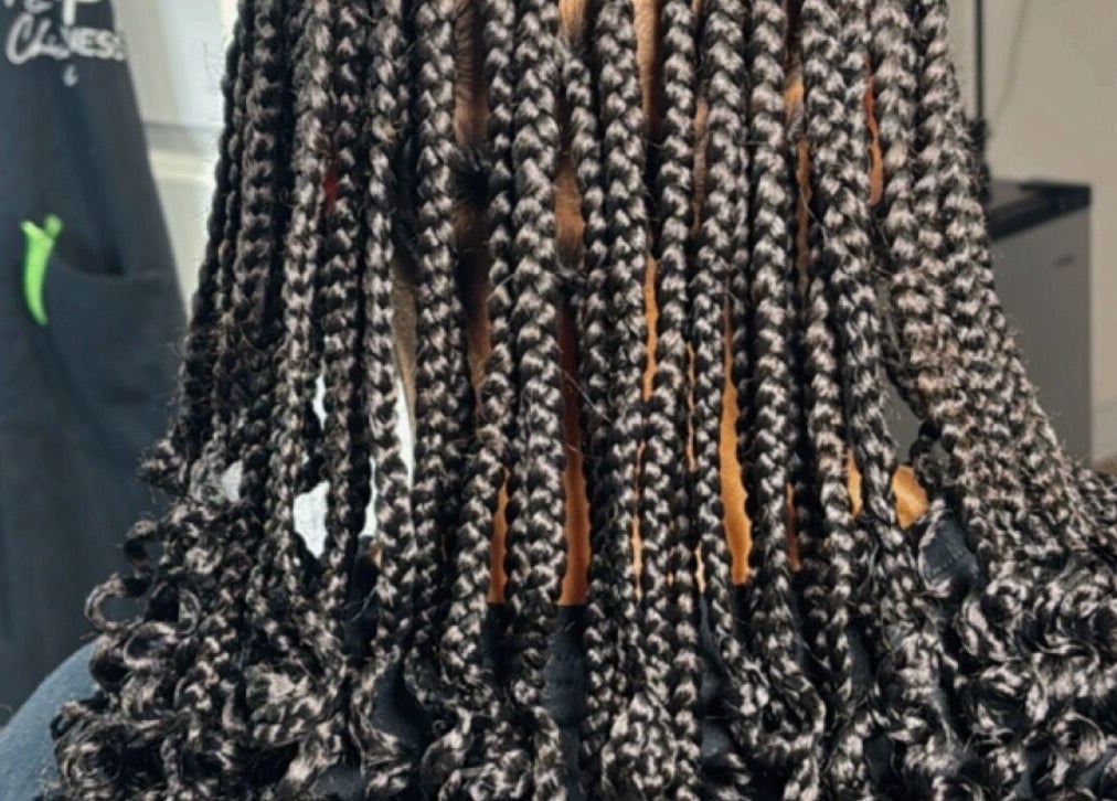 Intricate braids styled at Michelle Todriana, Hammond, Illinois, US, showcasing professional beauty craftsmanship.