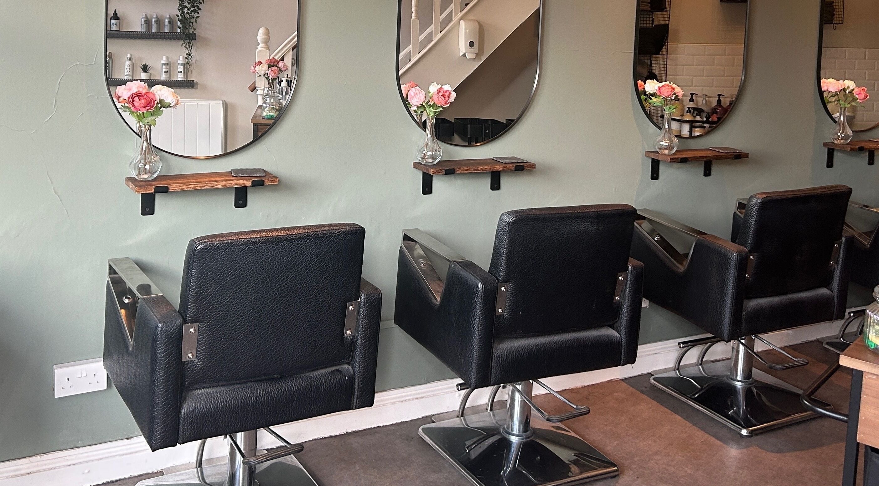 Modern hairdressing chairs at Hannah Williams Hairdressing @ Belle Dame Hair and Beauty, Bristol, England, GB.