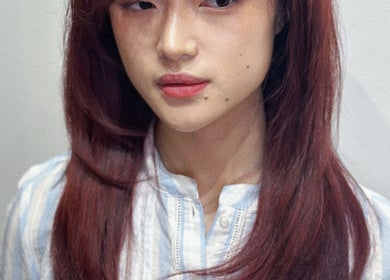 Stylish woman with red hair at Iris Hair Design at L'Attitudes EMTC, Mississauga, Ontario, CA.