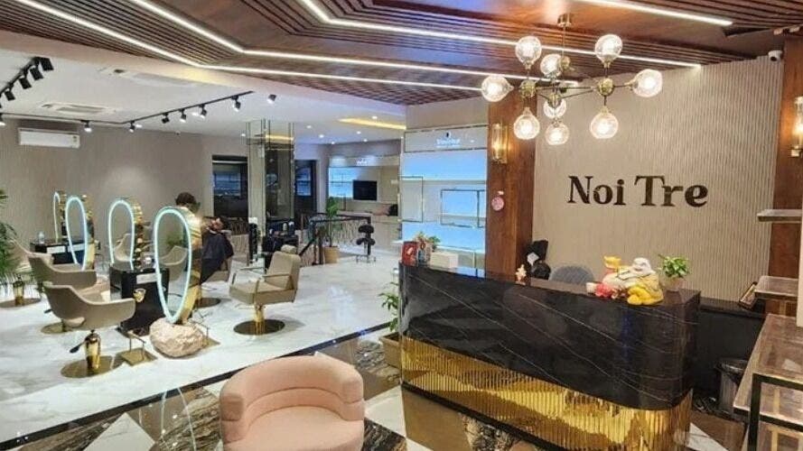 Chic interior of Curl Care - Noi Tre Ashok Vihar in Delhi, Delhi, IN, featuring modern salon seating and lighting.