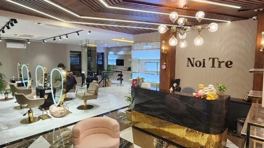 Chic interior of Curl Care - Noi Tre Ashok Vihar in Delhi, Delhi, IN, featuring modern salon seating and lighting.