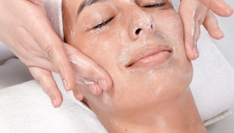 Woman receiving a facial massage at BCM Aesthetics in London, England, GB.