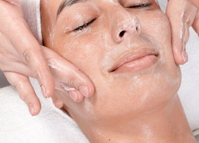 Woman receiving a facial massage at BCM Aesthetics in London, England, GB.