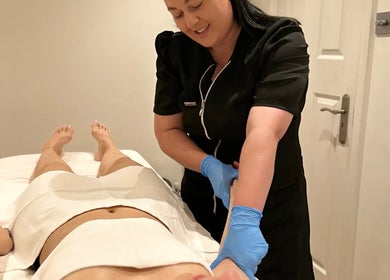 Therapist at BCM Aesthetics, London, England, GB provides relaxing treatment session.