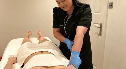 Therapist at BCM Aesthetics, London, England, GB provides relaxing treatment session.