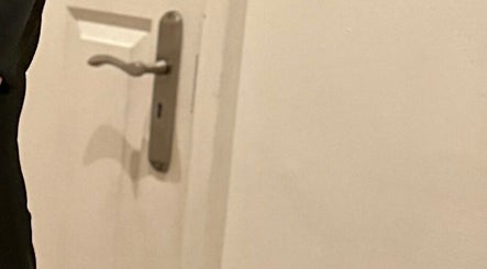 Stylish door handle at BCM AESTHETICS in London, showcasing entry to wellness services.