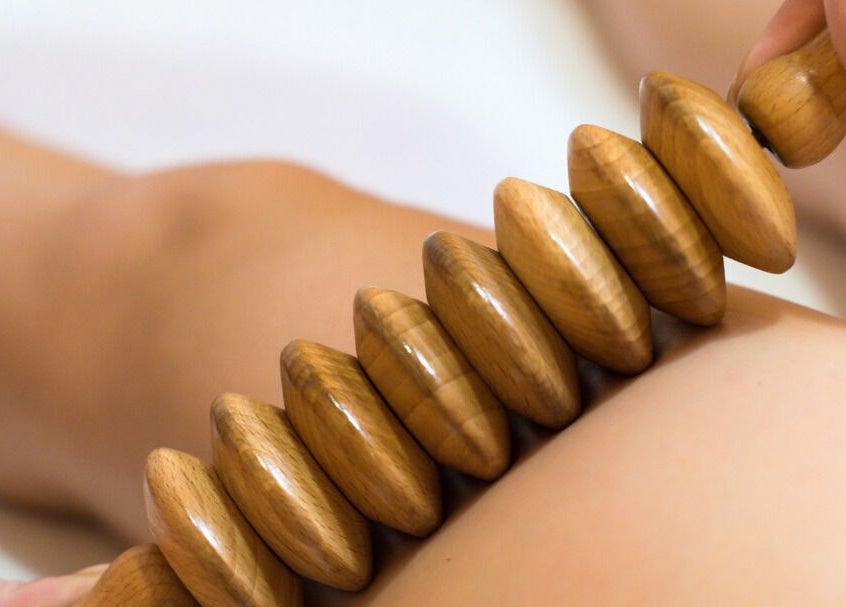Wooden massage roller at LymphLondon by Bruna Milioli | Home Service in London, England, GB.