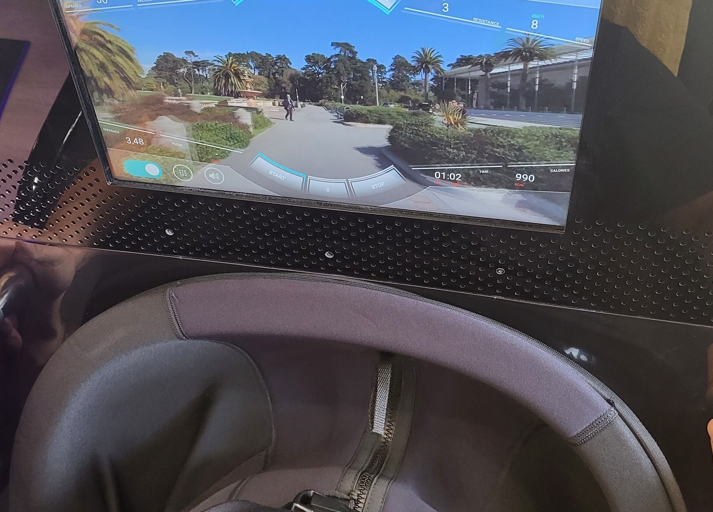 Virtual cycling setup at GlowFit Wellness, Melbourne, Victoria, AU with digital screen and handlebars.