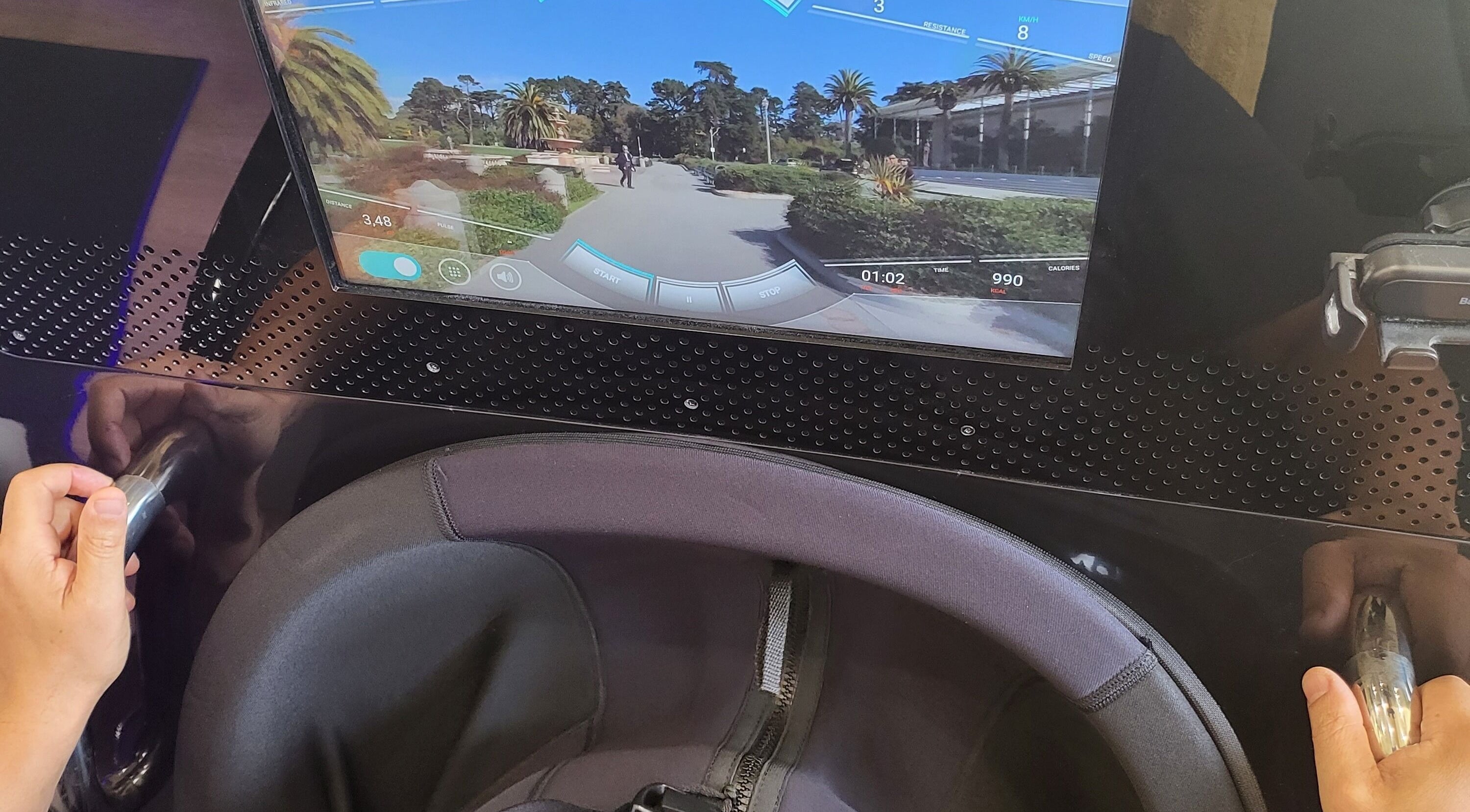 Virtual cycling setup at GlowFit Wellness, Melbourne, Victoria, AU with digital screen and handlebars.
