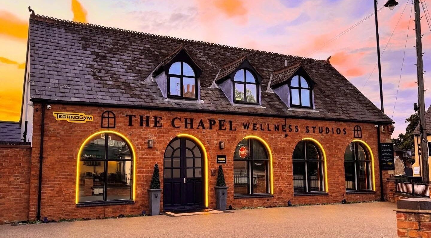 AP Beauty MK in Towcester, England, GB at sunset, showcasing a tranquil brick wellness studio.