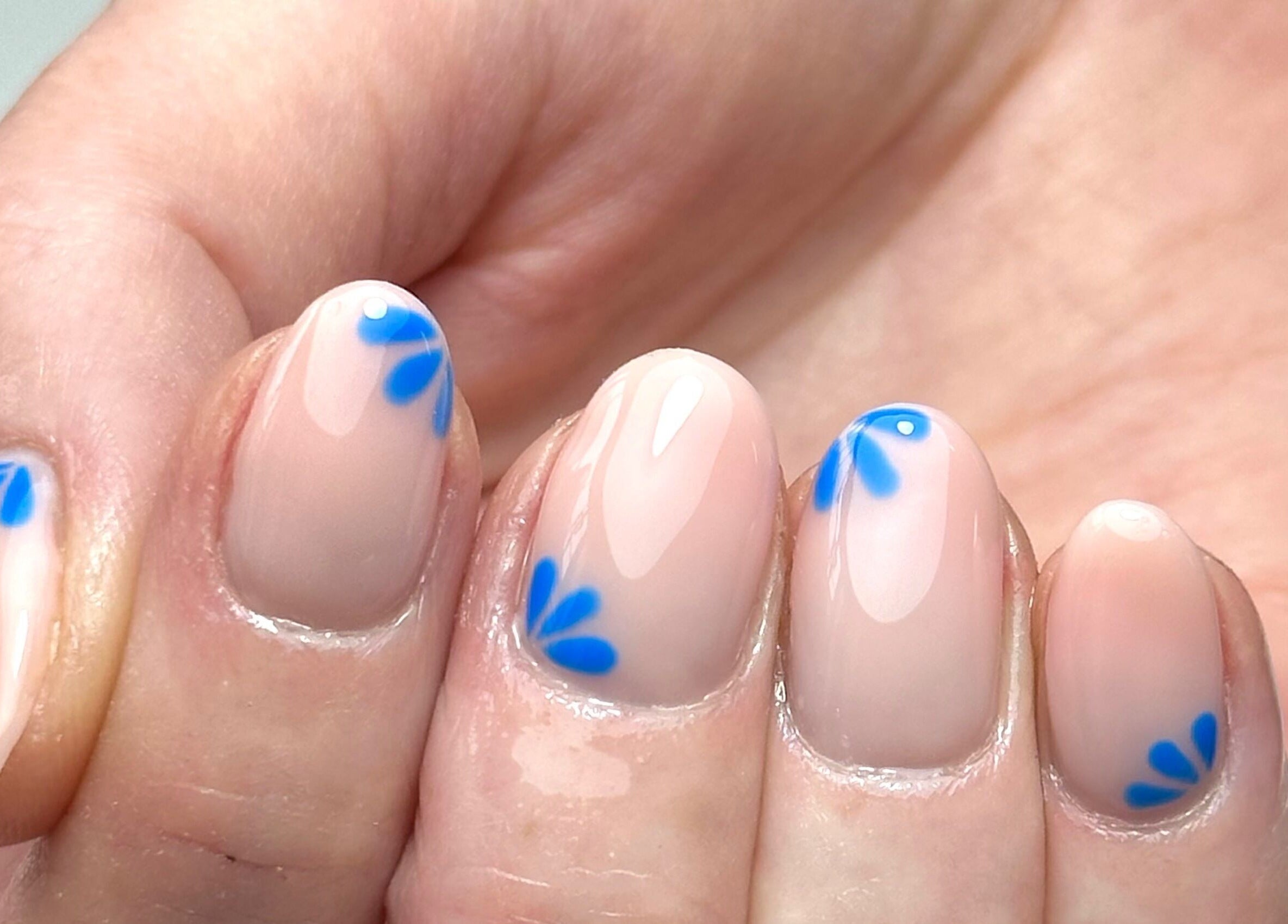 Elegant blue petal nail art at AP Beauty MK, Towcester, England, GB. Perfect for chic, modern styles.