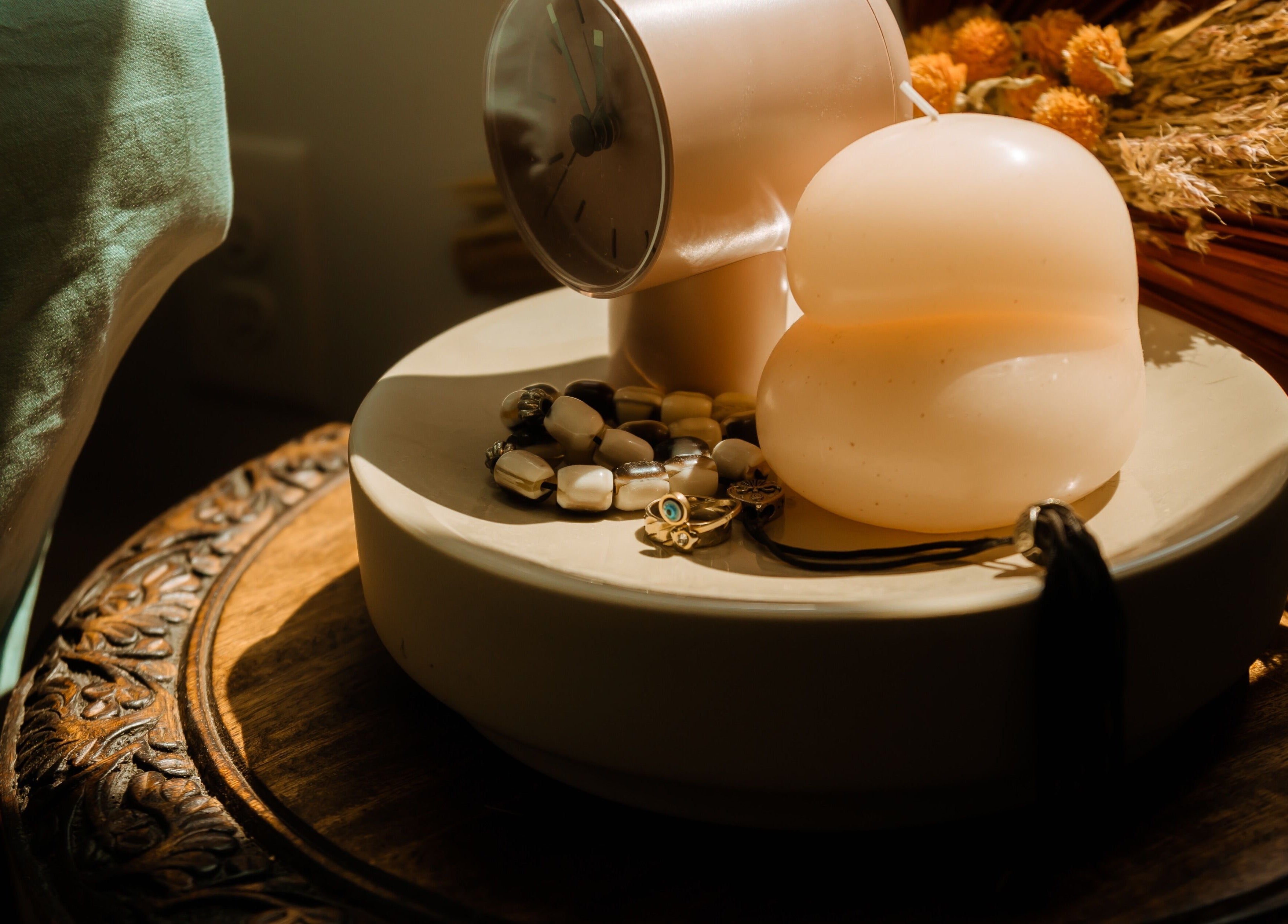 Elegant decor with a modern candle and jewelry at Hands of Chiron, Baltimore, Maryland, US.