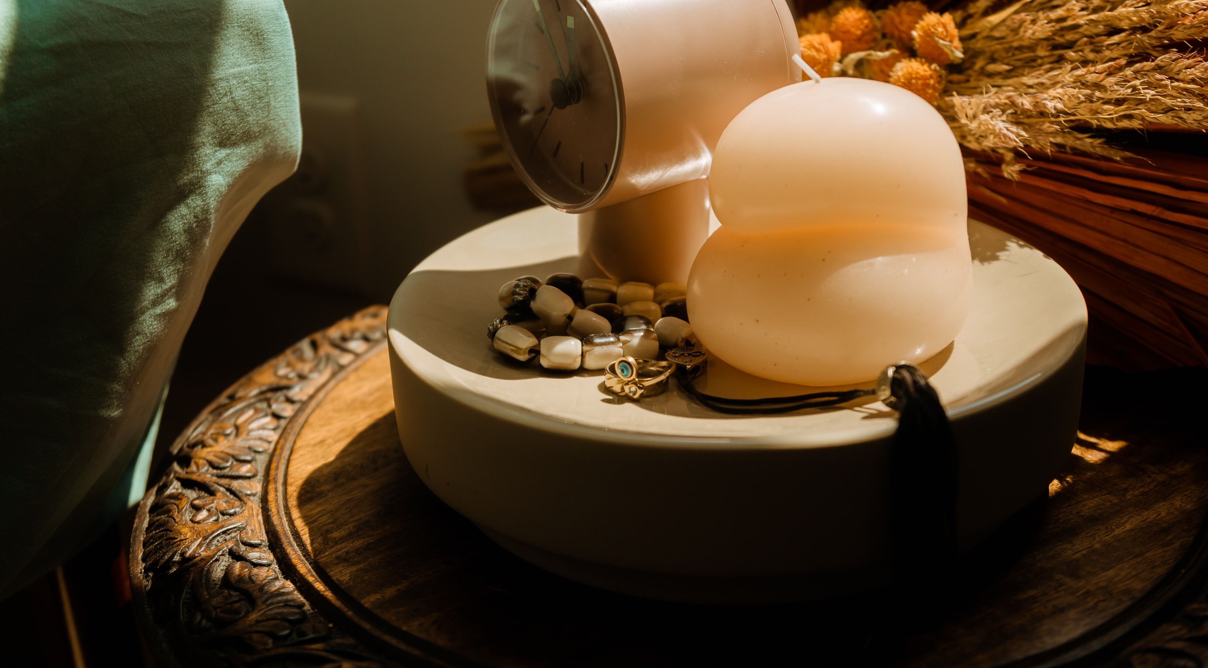 Elegant decor with a modern candle and jewelry at Hands of Chiron, Baltimore, Maryland, US.