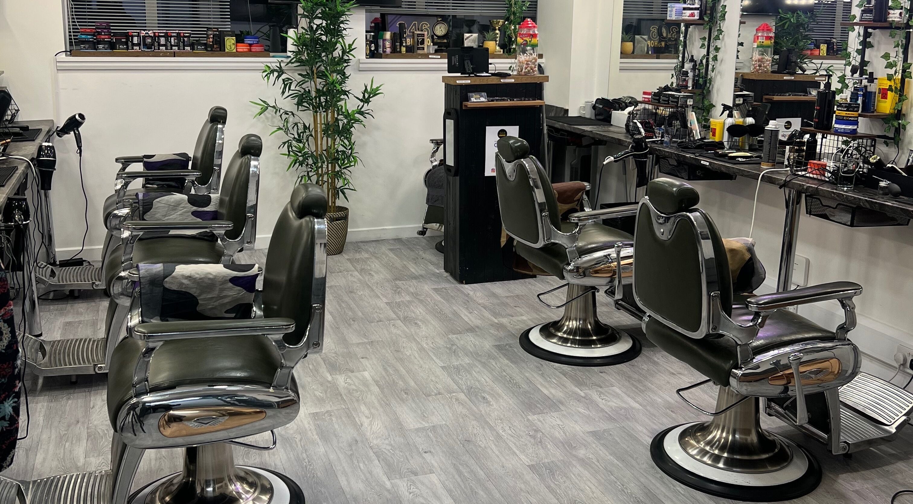 Stylish interior of 346 Barbershop - Oxford Road - Manchester City Centre, Manchester, England, GB with vintage barber chairs.