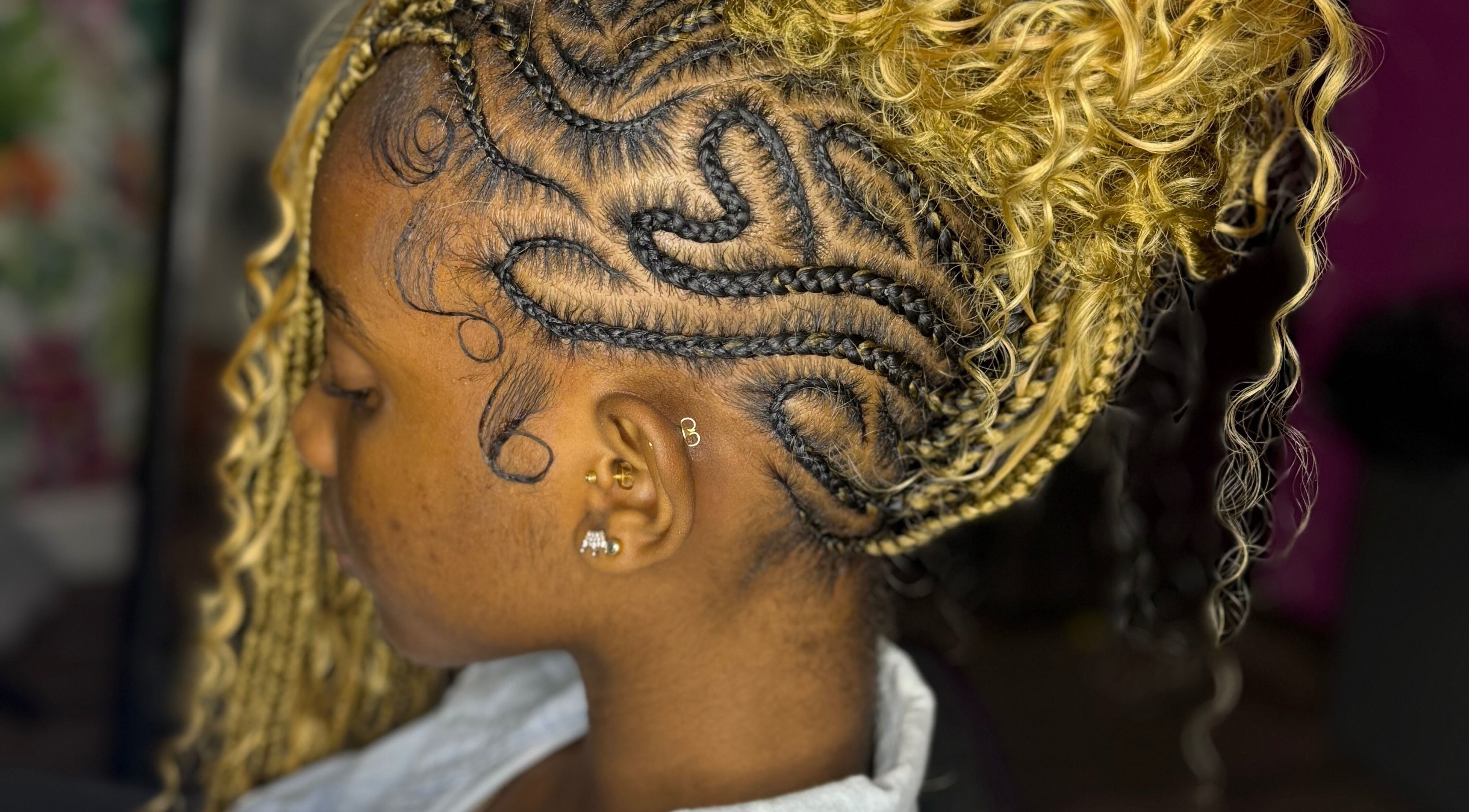 Intricate braids hairstyle at GoldPosh Beauty Parlour in Bridgetown, Saint Michael, BB.