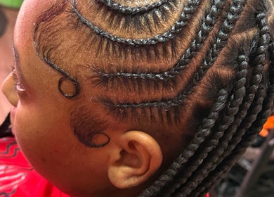 Intricate braid design at GoldPosh Beauty Parlour showcasing stylish hair artistry in Bridgetown, Saint Michael, BB.