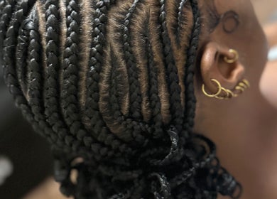 Intricate braids at GoldPosh Beauty Parlour, Bridgetown, Saint Michael, BB, showcasing expert styling.