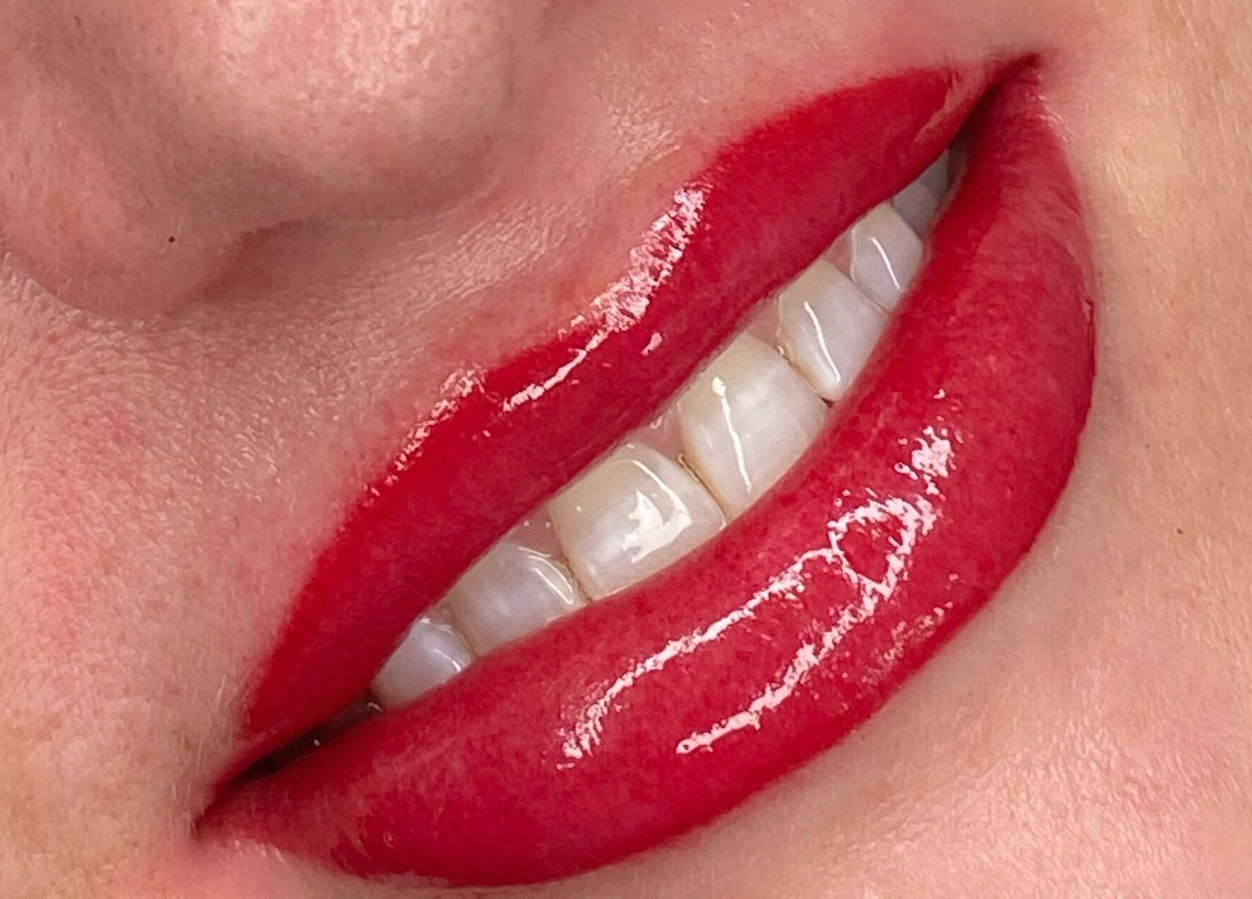 Vibrant red lips with gloss from Beauty Box SPMU & Aesthetics Anna Tempska in Bingham, England, GB.