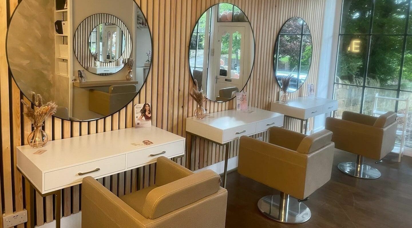 Elegant salon chairs and mirrors at One Hair Spa, East Keswick, England, GB, offering a stylish beauty experience.