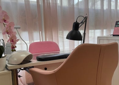 Chic salon desk with orchid at Glam Body, Penrith, New South Wales, AU. Perfect for beauty treatments.